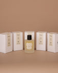 Five Vellie Wrap Spray boxes surrounding the Hope Wrap Spray. Each spray is crafted with the finest raw materials and expertly blended by a Paris-trained Seattle-based Master Perfumer. Handmade by women with love.