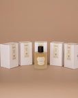 Five Vellie Wrap Sprays displayed together. Scent showcased is Open. Each scent is crafted with the finest raw materials and expertly blended by a Paris-trained Seattle-based Master Perfumer. Handmade by women with love.