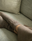 Set of soft alpaca socks. Warm, comfortable feet signal safety. When your foundation feels secure, your entire nervous system can exhale.