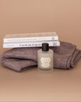 How Sweet It Is gift bundle. Two Brianna Wiest books, a sustainably made baby alpaca wrap, and an all natural clean beauty wrap spray.