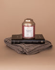 I'll Stand By You Gift Bundle. Displayed here stacked: folded Vellie Wrap made from sustainably sourced baby alpaca, The Pivot Year paperback by Brianna Wiest and Rooibos Vanilla Tea by Tea Heaven.
