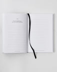 Interior preview page 34 of self-guided journal I Am The Hero Of My Own Life. Lined sheet to write your own thoughts. Journal includes more writing prompts and questions. Black ribbon to bookmark your spot.