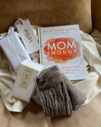 Superwoman Gift Bundle box curated for any feminine figure in your life. Celebrate motherly love with this gift box. Mom Enough book by Rachel Marie Martin, luxury Candle, sustainable wrap, free socks.