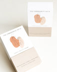 Packaging of The Embodiment Deck, a set of 48 affirmation and embodiment cards created by a women-owned and Latina-owned business to help women reconnect with their bodies. Illustration of female figure by Stephanie Dykert.