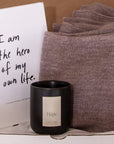 Unboxing of gift bundle by Vellie inside is the journal by Brianna Wiest, "I am the hero of my own life", a Vellie luxury candle and a Vellie baby alpaca wrap.