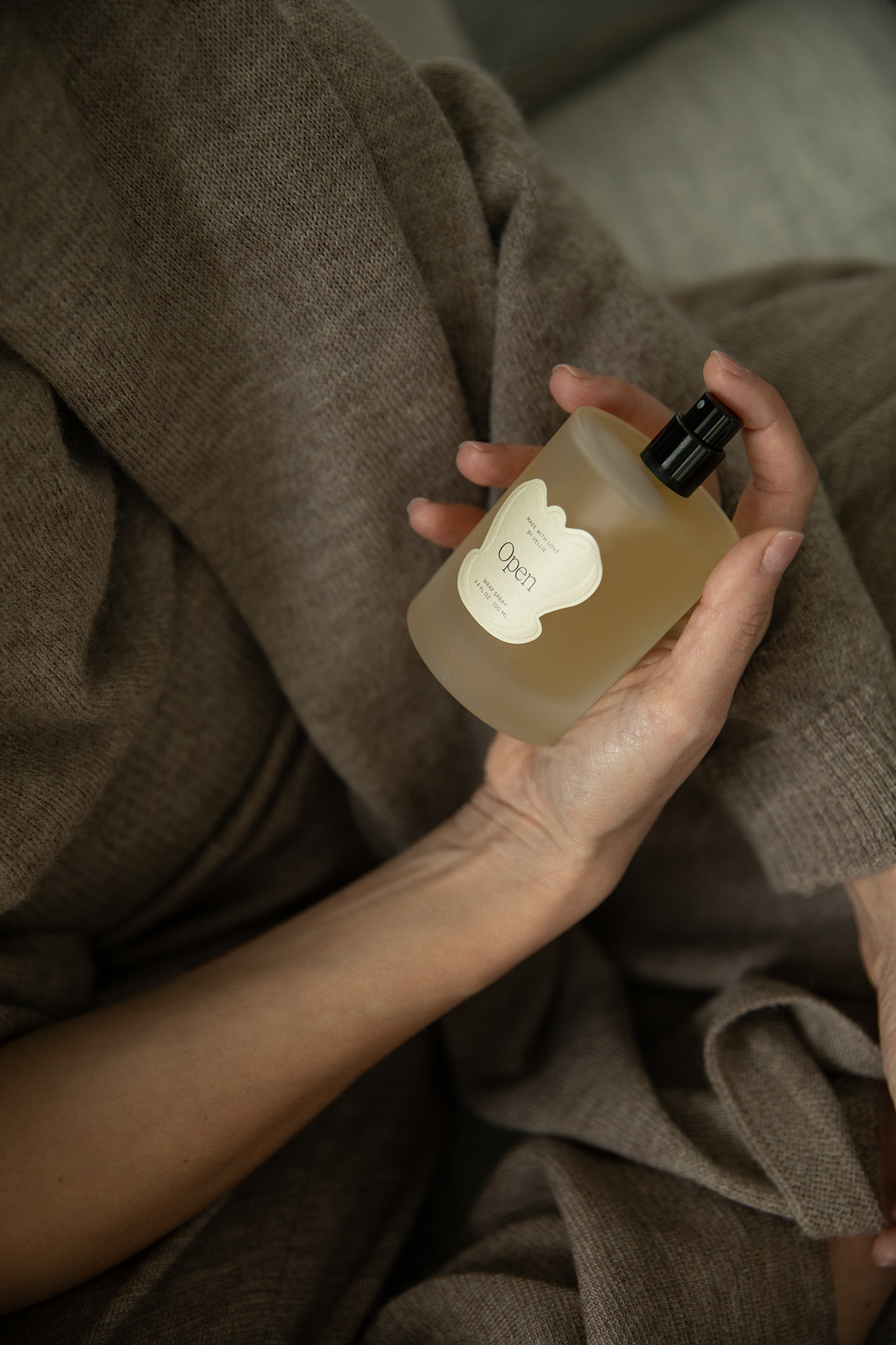 A clean beauty all natural spray in the scent Open made by Paris-trained master perfumer in Seattle, Wa. Designed to spray on the Vellie Wrap.
