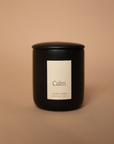 Vellie Calm Candle in a black vessel with minimalist design, featuring a calming fragrance blend of bergamot, chamomile, and lavender.