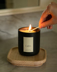 Vellie candle lit in bathroom, filling the space with calming lavender and chamomile fragrance.