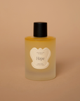 Vellie Hope Wrap Spray, crafted with 100% natural perfumery-grade essential oils, including bergamot, lemon, and rose. Designed to spray on your Vellie luxury wrap.