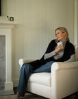 Relax in Vellie’s sustainable black alpaca wrap, offering cozy, comforting warmth—an ideal gift for those experiencing grief, loss, or challenging life transitions.