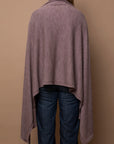Back view of mauve Vellie wrap with a high-low design, featuring its luxurious 100% fair-trade baby alpaca fiber and elegant, flowing drape. Ethically made in Peru.