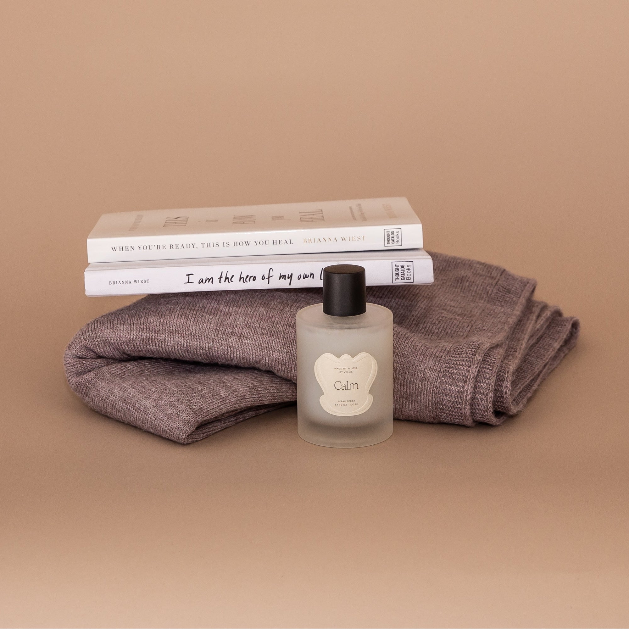 How Sweet It Is gift bundle. Two Brianna Wiest books, a sustainably made baby alpaca wrap, and an all natural clean beauty wrap spray.